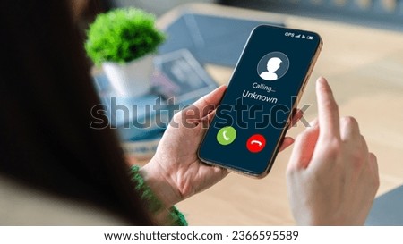 Human use smartphone with incoming call from unknown number, spam, prank caller, hoax person, fake identity, scammer, scam with mobile phone, hacker, call center, crime, call, fraud or phishing  Royalty-Free Stock Photo #2366595589