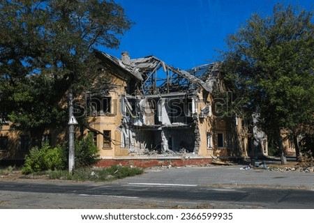 A residential building was destroyed by an explosion as a result of Russia's war against Ukraine. A residential building damaged burned down from the consequences of the fighting
in Mariupol. Royalty-Free Stock Photo #2366599935
