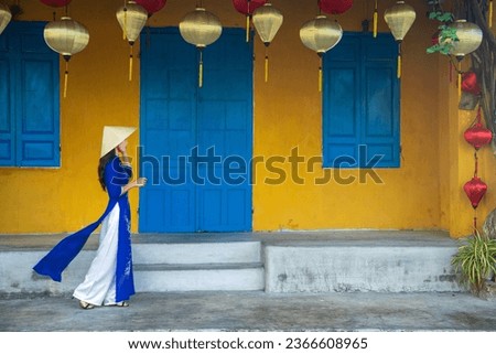 Asian woman in traditional Vietnamese costume in Vietnam walking street
 Royalty-Free Stock Photo #2366608965