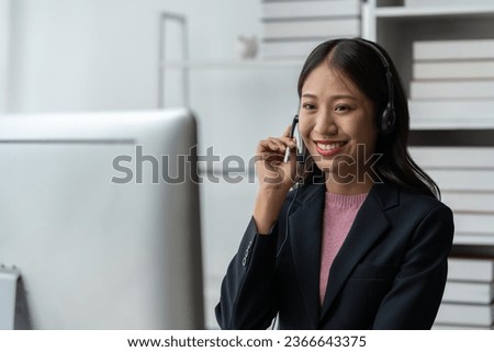 Asia call center with headset and microphone working on laptop Female entrepreneurs serving customers, business information, inquiries Support call center representatives help customers.