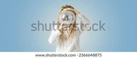 Woman holding disco ball in front of face, no face concept parties, events, dances. Female with long hair dreadlocks hiding behind shiny mirrorball. Wide banner copy space, blue gradient background