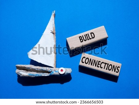 Build Connections symbol. Concept word Build Connections on wooden blocks. Beautiful blue background with boat. Business and Build Connections concept. Copy space