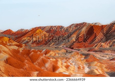 Zhangye colorful danxia landform scenic spot, vertical image with copy space for text. Yellow and terracotta colors of rocks Royalty-Free Stock Photo #2366664939