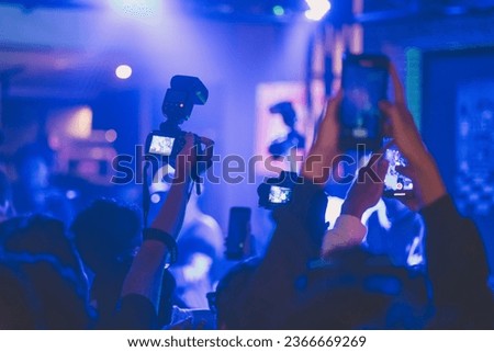 Crowd was taking pictures and videos at the gig
