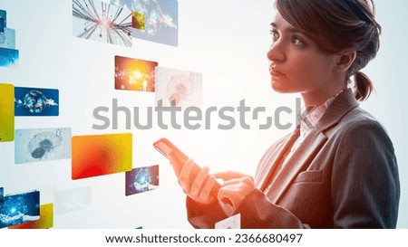A woman using a smartphone and a CG screen. Video content. NFT.
