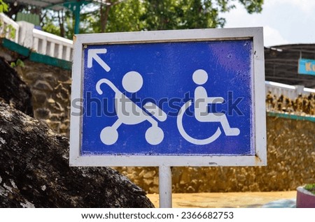 signs for disabled people and baby trolleys