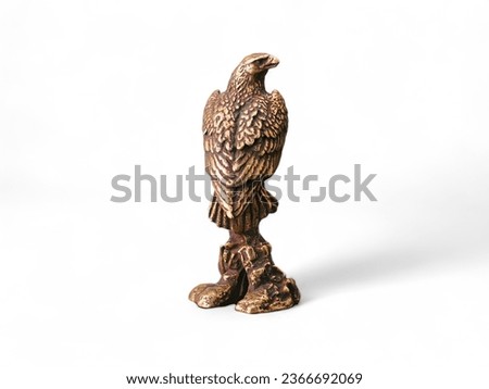 Golden eagle miniature sculpture animal on white background