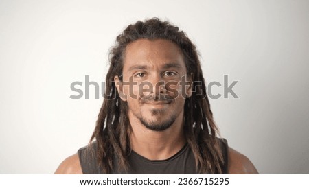 Happy person with dreadlocks look camera. Male hair style close up. Cute brutal smiling man face portrait. One joy 30s guy head shot. Nice dread hairstyle. Young adult hipster have fun. Good mood life Royalty-Free Stock Photo #2366715295