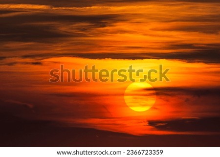 Glowing sun, sunset with clouds, evening sky, Germany