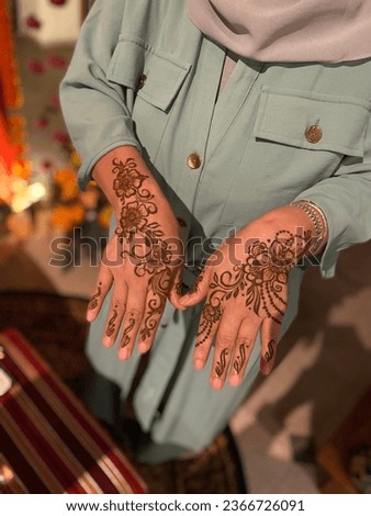 simple flowery henna design on the hands Royalty-Free Stock Photo #2366726091