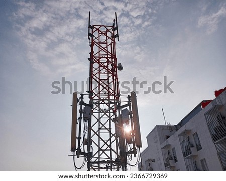 photo of a telecommunications tower with a blue sky background