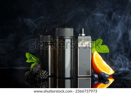Vape and smoking liquid with fruit against black background with smoke