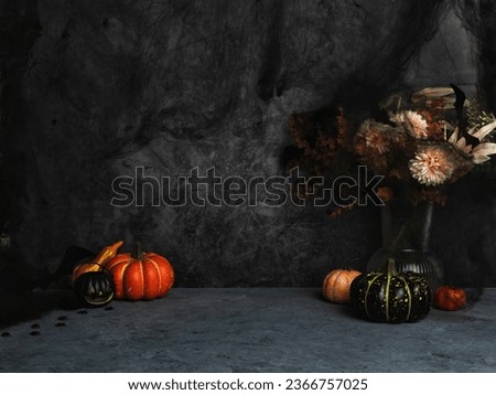 Halloween home office workspace with spider web. Cozy fall background with pumpkins