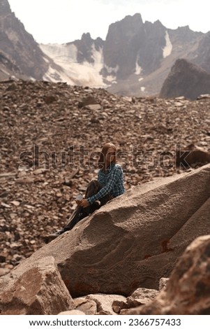 Girl enjoying coffee in the mountains on a glacier