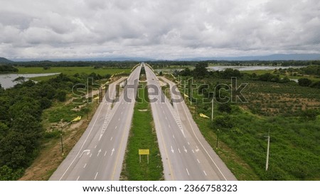 Aerial view of a city highway and overpass on a cloudy day.