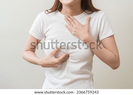 Acid reflux disease, suffer asian young woman have symptom gastroesophageal, esophageal, stomach ache and heartburn pain hand on chest from digestion problem after eat food, Healthcare medical concept Royalty-Free Stock Photo #2366759243