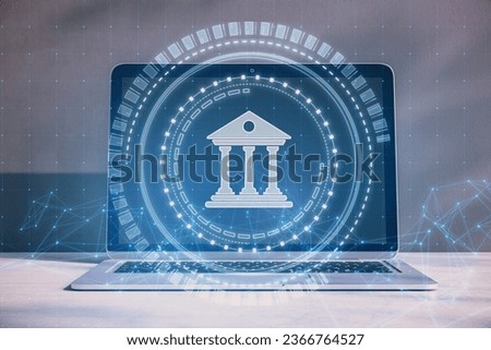 Close up of laptop computer with creative polygonal round banking hologram on blurry concrete wall background. Digital transformation and finance concept