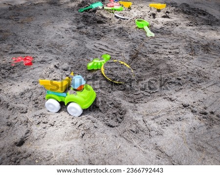 Colorful children toys on the sand beach