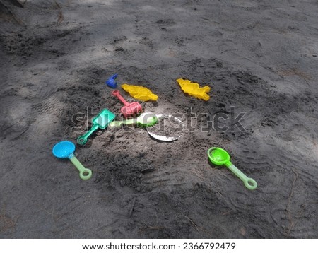 Colorful children toys on the sand beach