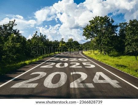 New year 2024 to 2026 written on the road in the middle of asphalt road, Planing of new year concept. Royalty-Free Stock Photo #2366828739