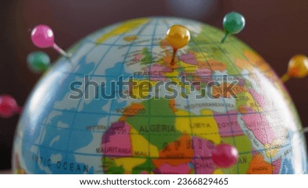 Globe Ball Countries Marked with Tailor Pins Rotating Royalty-Free Stock Photo #2366829465
