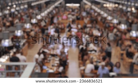 Anonymous Crowd in Food Hall Market Eating at Restaurant Tables Royalty-Free Stock Photo #2366836521