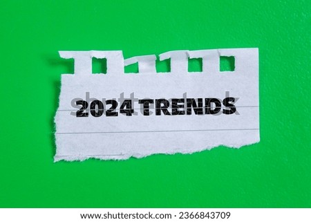 2024 Trends lettering on torn paper. New year 2024 concept photo.