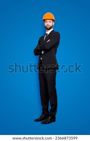 Full length size portrait of attractive beardedstylish investor in hard hat, black tux, tuxedo with tie, isolated on grey background, having his arms crossed Royalty-Free Stock Photo #2366873599