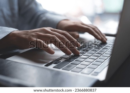 Close up of business woman hands working, typing on laptop computer keyboard, surfing the internet on office desk, online working, telecommuting, freelancer at work concept Royalty-Free Stock Photo #2366880837