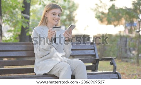 Young Business Lady Shopping Online while Sitting on Bench