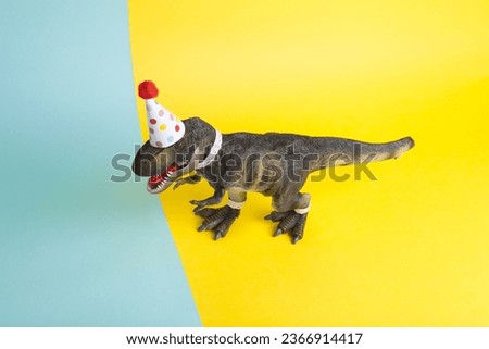 a dinosaur, dressed up in lace and a paper party hat, at a birthday party against a yellow and blue background. Minimal creative still life colourful photography