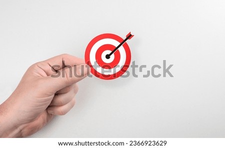 Setting goals, strategy, success concept. Businessman holding target, business targeting, aiming, focus concept. Business achievement goal and objective target concept.