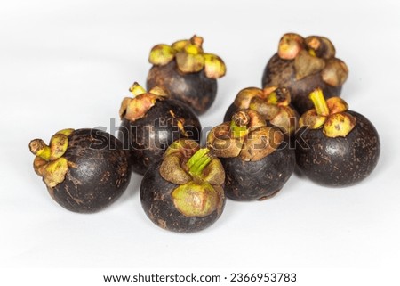 Isolated mangosteens or buah manggis. Group of mangosteens, fresh tropical fruits mangosteen isolated on white background. close up