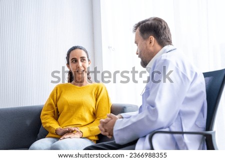 male  doctor and Female patient Talk and give advice about the illnesses of patients in the hospital