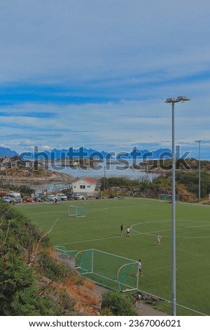 Henningsvaer football pitch. Lofoten Islands. Photo taken from Henningsvær, Norway in August 2023