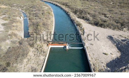 Aerial view of gates in irrigation canal. Water care.
