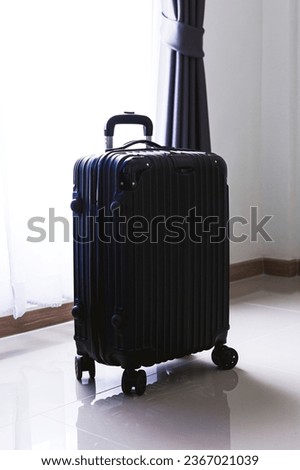 black travel bag,Luggage or suitcases in modern hotel during check-in It's time to travel, service, travel, summer vacation and vacation concept