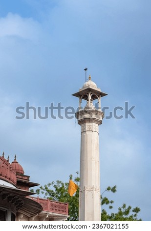 ancient artistic holy jain temple holy pillar with cloudy sky at morning image is taken at Soni Ji Ki Nasiya Jain Temple, Ajmer, Rajasthan, India.