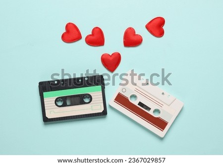 Audio cassettes with hearts on blue background. Music lover, love song