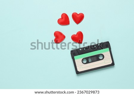 Audio cassette with hearts on blue background. Music lover, love song