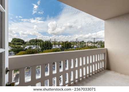 Contemporary Balcony Photoshoot footage located in Florida, USA. Showcasing modern architectural design and development. Beautiful clear sky and commercial area view.