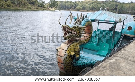 view of the water bicycle tourist attraction on the Jembangan Adventure Park lake.
Kebumen - 23 September 2023