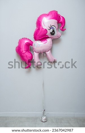 pony with pink mane balloon on white background