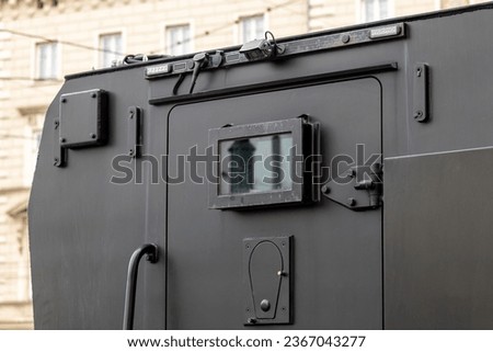 Armored vehicle car truck back door detail, jail prison van, money valuables transport prisoner transportation special operations heavily armored military vehicles simple conceptual symbol closed door Royalty-Free Stock Photo #2367043277