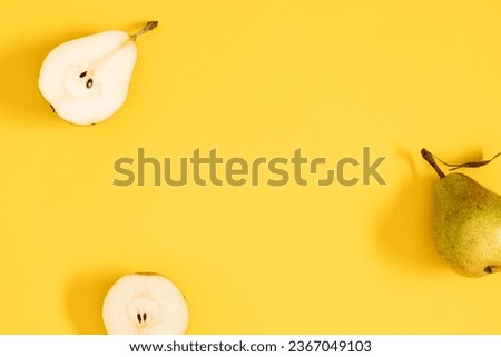 Yellow pears pattern. Close up of pear on yellow background. Autumn fruit concept from ripe juicy pears. Flat lay, top view Royalty-Free Stock Photo #2367049103