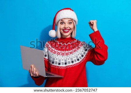 Photo of sweet lucky woman lady santa elf wear ornament pullover winning game modern gadget isolated blue color background