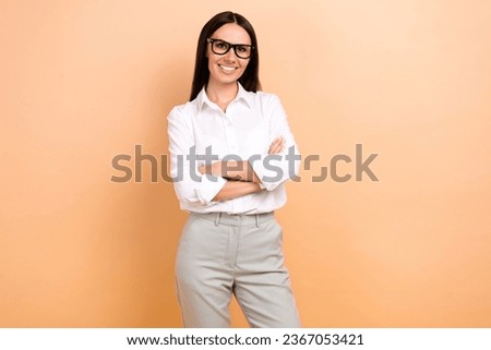 Photo of successful gorgeous cheerful representative lady toothy smile crossed arms posing isolated on beige color background