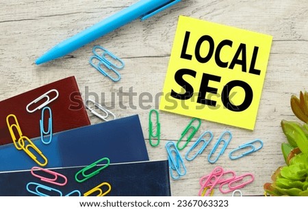 LOCAL SEO many bright paper clips on the slot. top view of sticker text