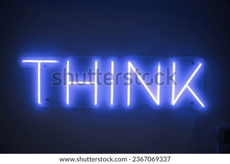 A blue Neon sign - THINK