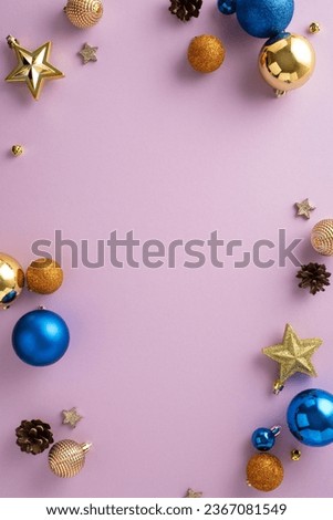 Picture-perfect holiday setup: Overhead vertical view of chic tree decorations, assorted blue, orange, and gold baubles, sparkling stars, tiny bells, pine cones, on light purple backdrop with ad space